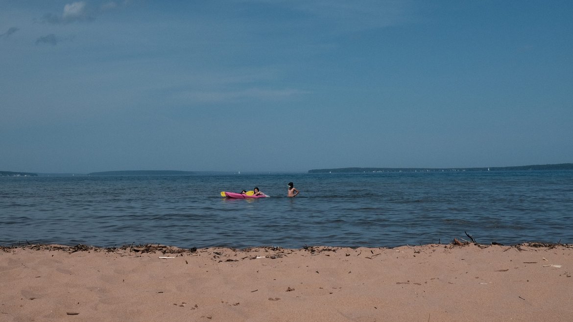 kids floating on lake superior photographed by Scott Gilbertson