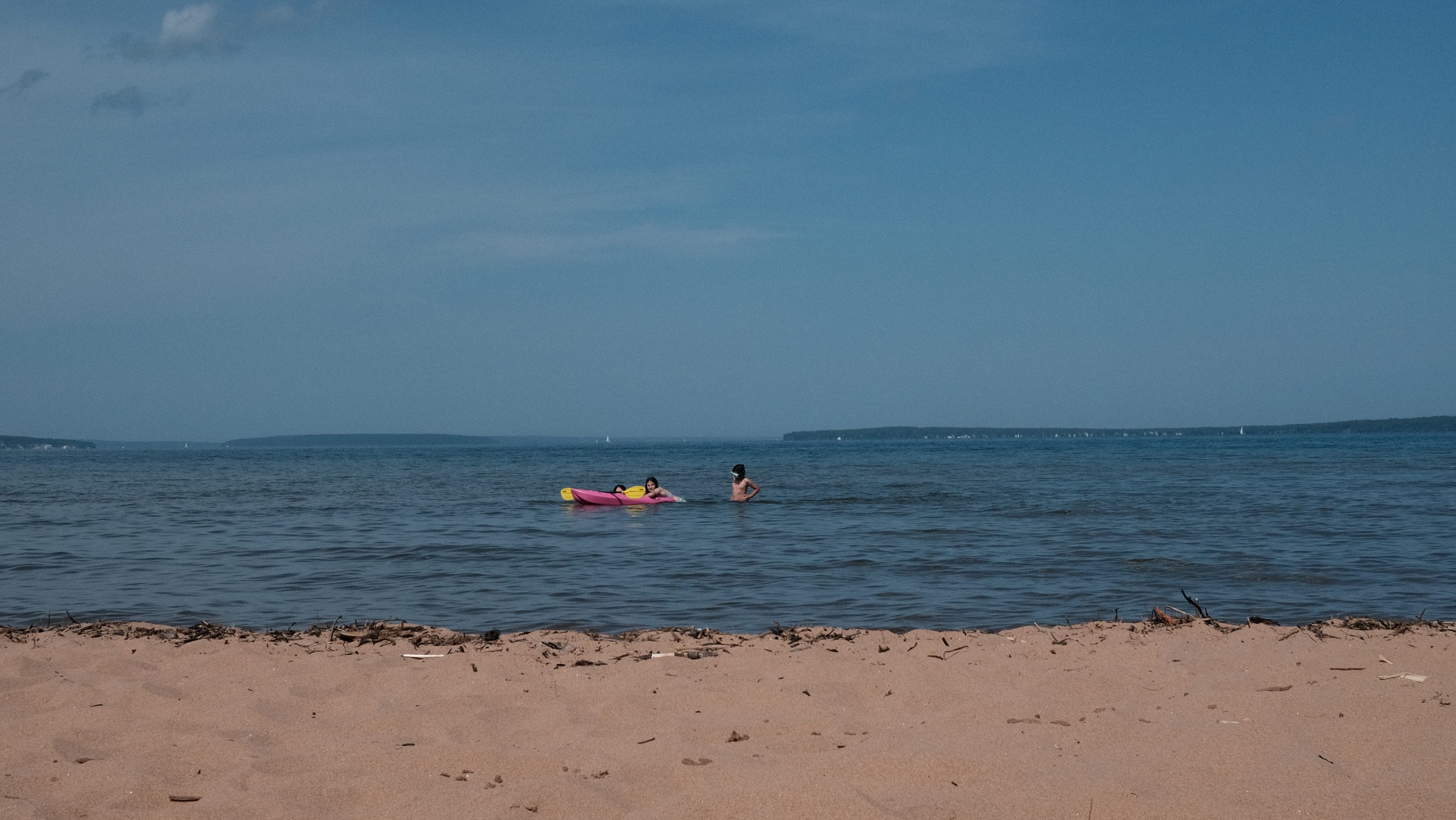 kids floating on lake superior photographed by Scott Gilbertson